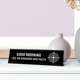 Good Morning I See The Assassins Have Failed Desk Sign, novelty nameplate (2 x 8")